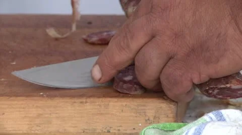 Cutting a piece of sausage. Видео 8946271