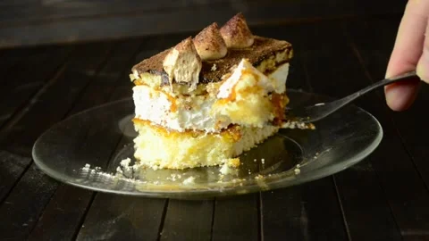 Cutting a piece of truffle cake with a fork on a dark background Video stock 262417505