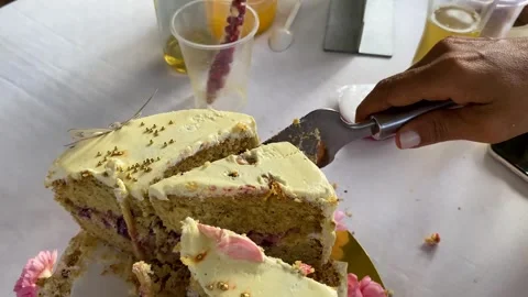 Cutting a piece of white cake Stock Footage 279677796