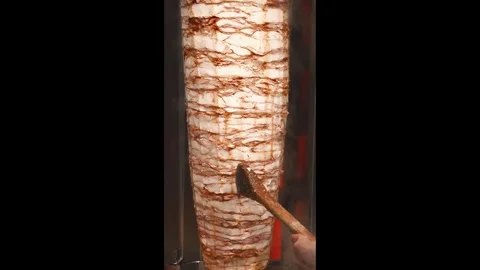 Cutting pieces with electrical knife meat for kebab 動画素材 304740150