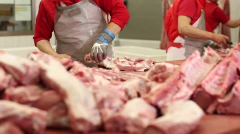 Cutting pig carcasses on a special table with knives Video stock 59869552
