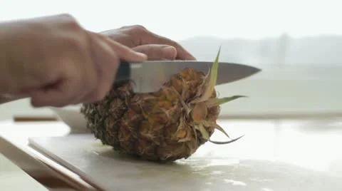 Cutting a pineapple Stock Footage 12139404