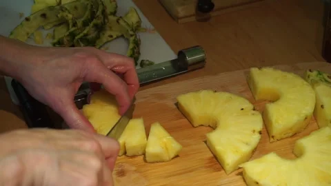 Cutting a pineapple  Stock Footage 168142600