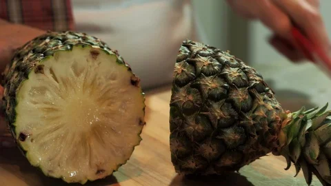 Cutting A Pineapple in Half Stock-Footage 127933038