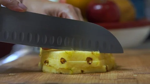 Cutting Pineapple slices close up  Stock Footage