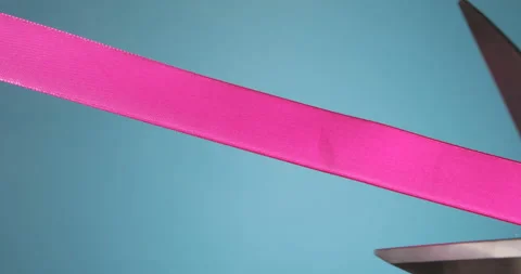 Cutting a pink ribbon Stock Footage 201296091