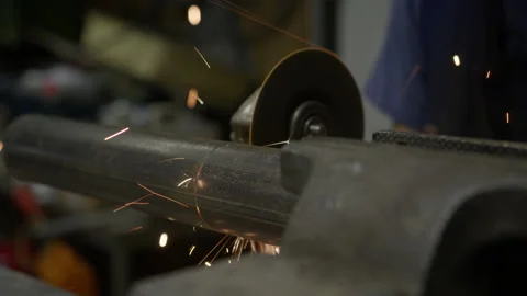 Cutting Pipe With An Angle Grinder In Workshop Video stock 234438928