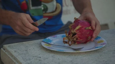 Cutting a Pitahaya Dragon Fruit closeup shot hand Stock-Footage 70761446
