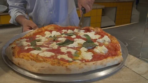 Cutting pizza  Stock Footage 71544508