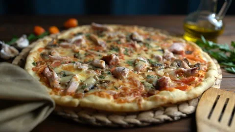Cutting pizza into pieces, close-up Stock Footage 87870837