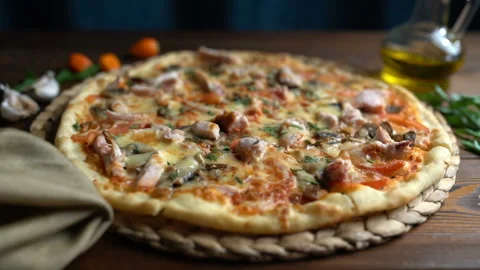 Cutting pizza into pieces, close-up Stock Footage 87870938