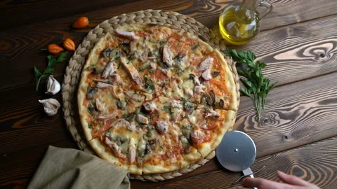 Cutting pizza into pieces, close-up Stock Footage 87870979