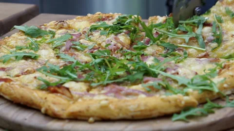 Cutting the pizza with a roller knife. Stock Footage 151108952