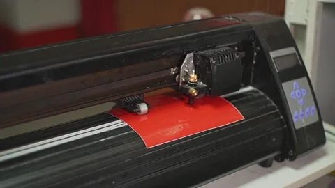 Cutting plotter and red film Stock Footage 224654811