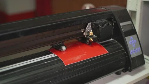 Cutting plotter and red film Stock Footage 224812699