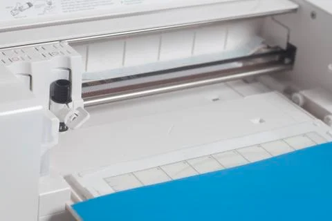 Cutting plotter with blue paper Stock Photos