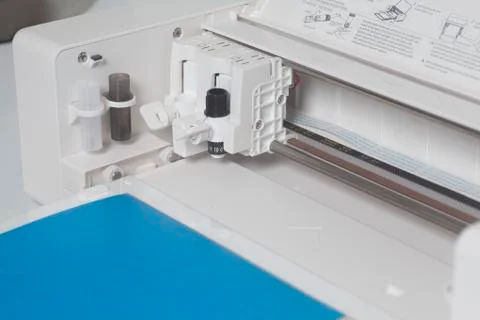 Cutting plotter with blue paper Stock Photos
