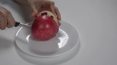 Cutting a pomegranate. 4K UHD Stock Footage 48338136