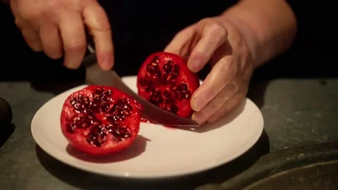 Cutting a pomegranate 스톡 동영상 221757675