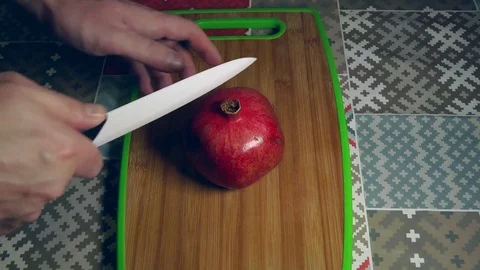 Cutting Pomegranate, hands of chef Stock Footage 83267078