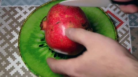 Cutting Pomegranate, hands of chef Stock Footage 83516034