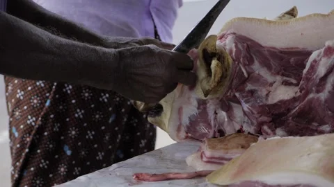 Cutting Pork  A Culinary Journey Through Meat Preparation Stock Footage 323997813
