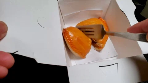 Cutting pork empanada with fork Stock Footage 102143530