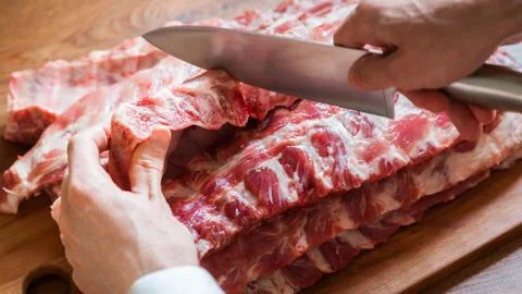 Cutting Pork Ribs Stock Photos