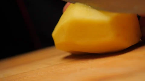 Cutting potato. Cut vegetables concept. Closeup Stock Footage 271500525