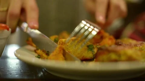 Cutting potato with a knife and fork Stock Footage 56620860