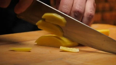 Cutting potato with a knife. Closeup Video stock 148527323