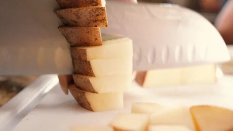 Cutting potato into pieces with a sharp knife Stock Footage 282374626