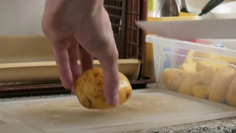 Cutting of potatoes, close up Stock Footage 142282575