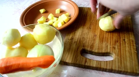 Cutting potatoes into pieces. Time lapse Stock Footage 67307589