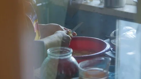 Cutting Potatoes. In the Red Basin .Kitchen Stock Footage 98149941