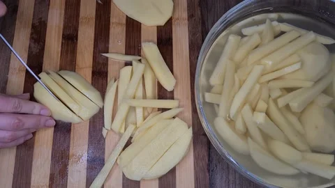 Cutting Potatos Video stock 165504771