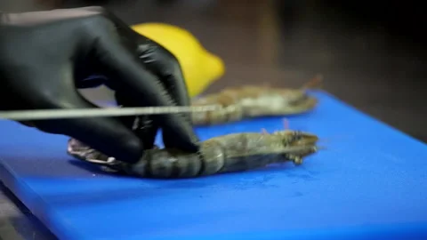 Cutting the Prawns Before Roasting Video stock 131366331