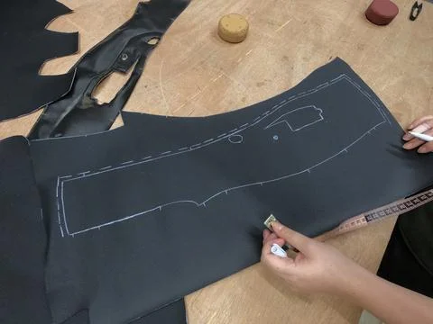 Cutting, preparing black leather or synthetic material for custom car interior Stock Photos