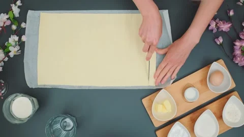 Cutting puff pastry into thin strips Stock Footage 250236612