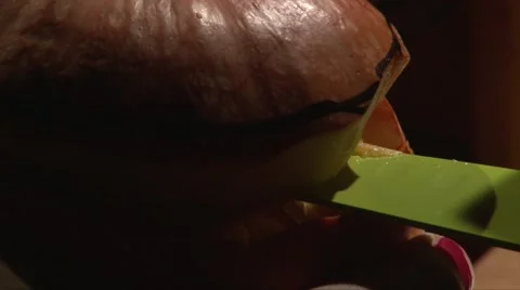 Cutting pumpkin top with a big knife, closeup shot, black background Stock-Footage 67885065