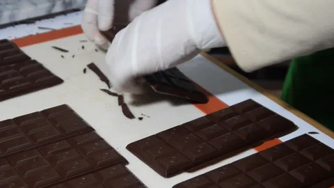 Cutting Pure Cacao Chocolate Bars Before Packaging Stock Footage 306780554
