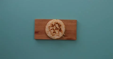 Cutting a quesadilla in half and then picking it up 1 Stock Footage 132203671