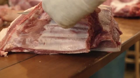 Cutting Raw Big Pork Stock Footage 137900438