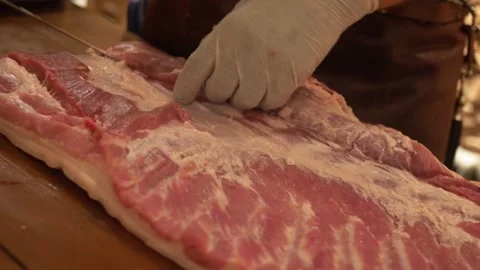 Cutting Raw Big Pork Stock Footage 137900673