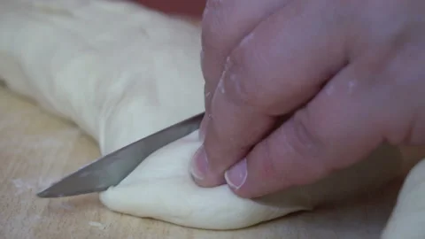 Cutting raw dough snow Stock Footage 90876254