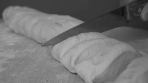 Cutting raw dough snow Stock Footage 90876278
