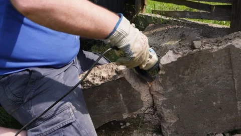 Cutting rebar in concrete block with angle grinder in slow motion Stock Footage 275297865
