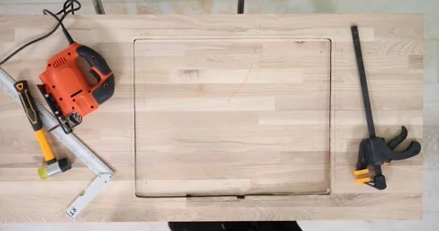 Cutting rectangular hole in wooden surface 動画素材 286079908