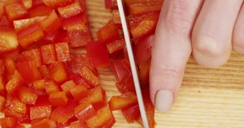Cutting Red Bell Pepper with Knife on Wooden board Top view Stock Footage 124745170