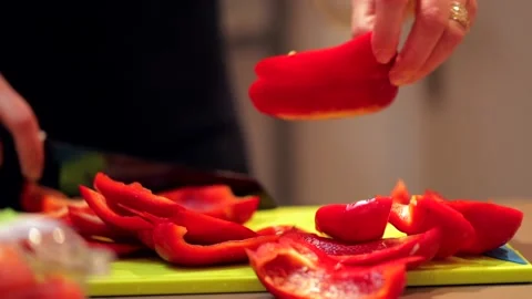 Cutting red bell peppers Stock Footage 149118679